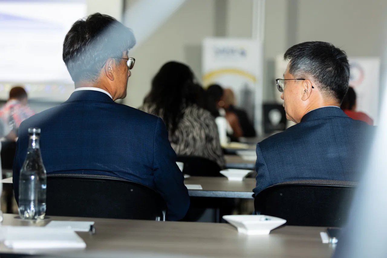 Delegates in conversation at an event